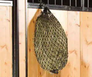 quarter bale net hanging on stall front